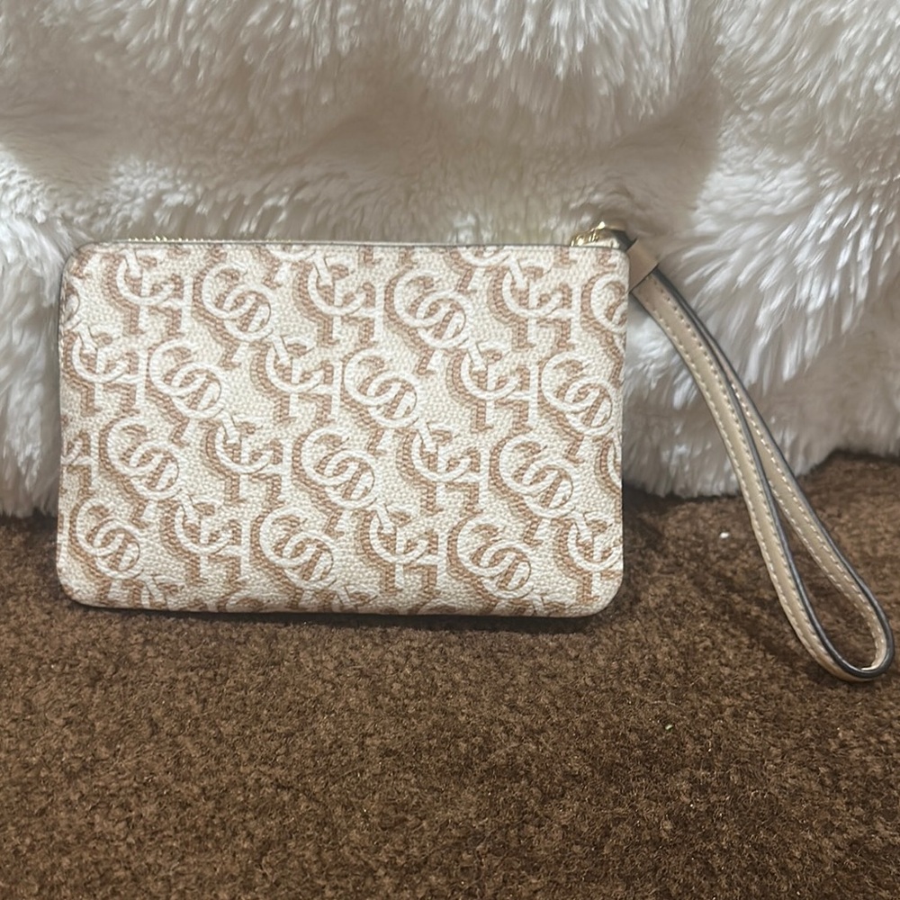 Coach Tan Clutch with Intricate Pattern